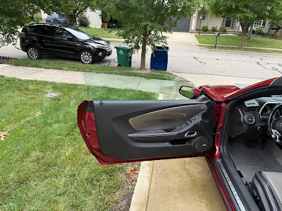 Open door showing a spotless detailed door panel and interior